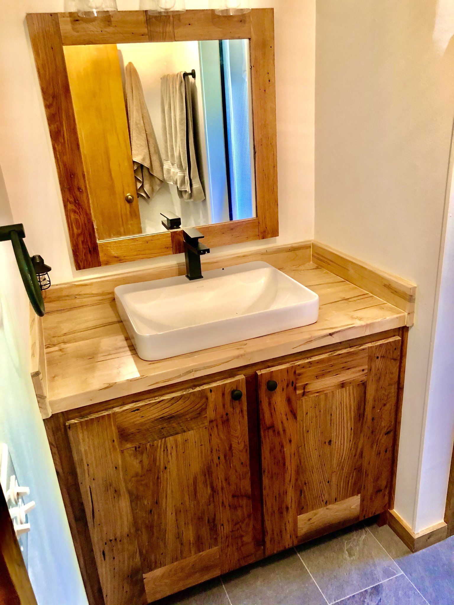 Custom bathroom vanity built from 100-year-old reclaimed chestnut with ambrosia maple countertop