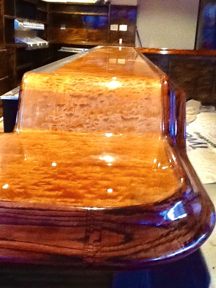 Highly polished amber burl epoxy bar surface with deep gloss finish