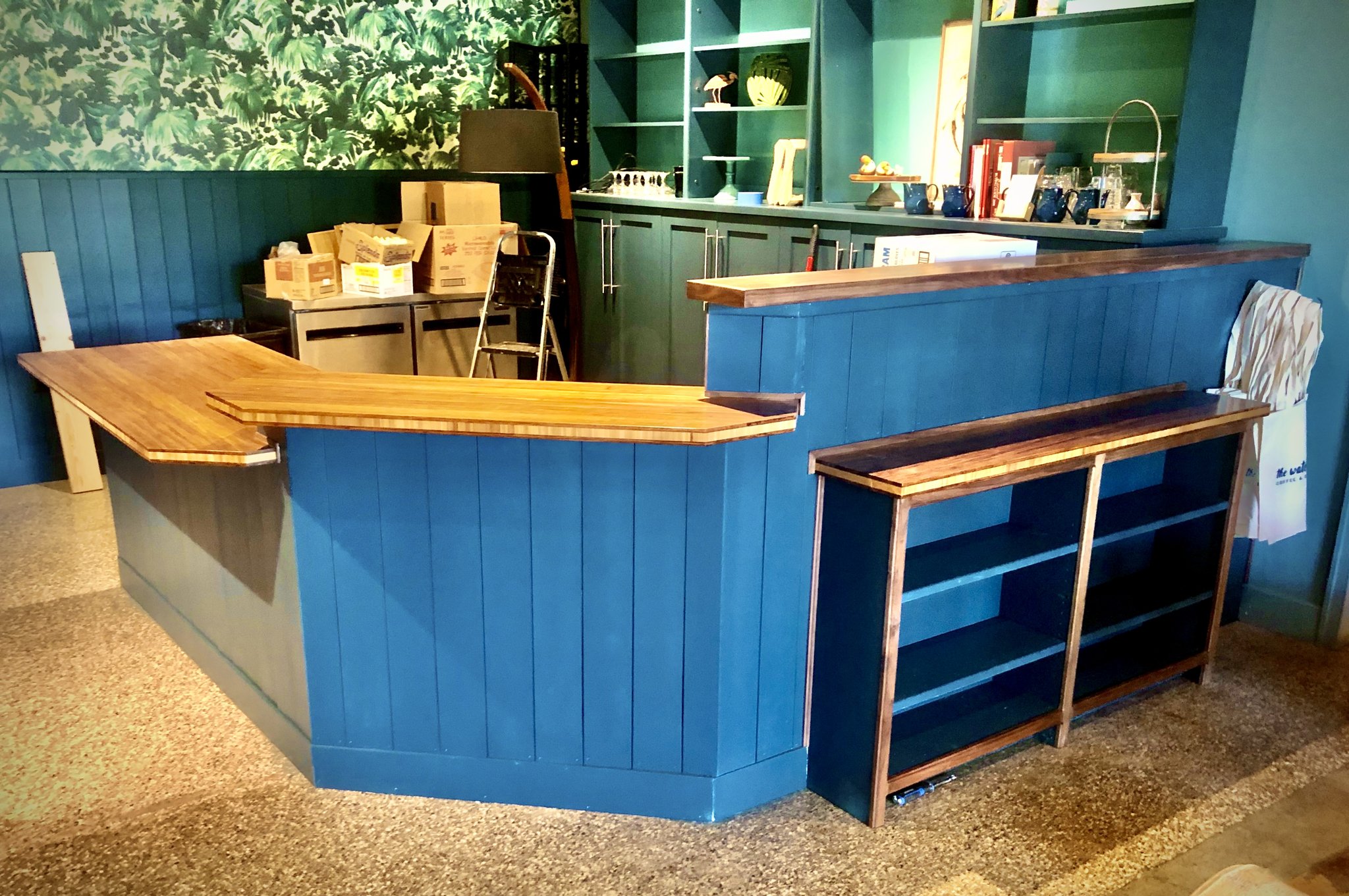 Custom painted nickel board and bamboo top sales counter at The Water Bird