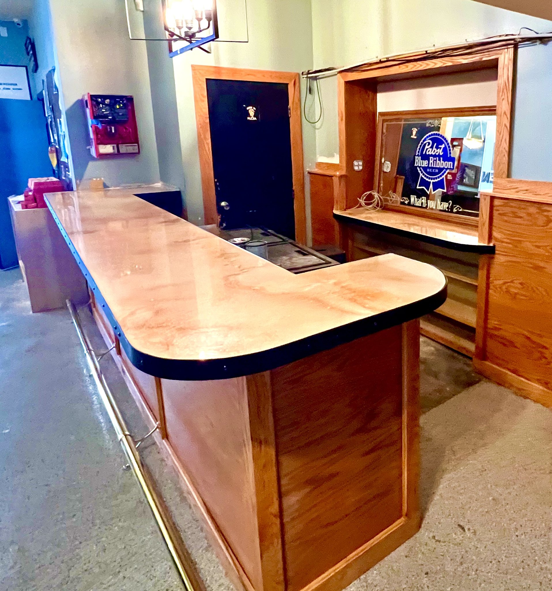 Full bar installation at The Alamo, Nunan GA — curved bar with custom millwork